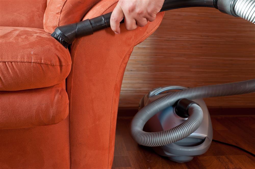 vacuuming a couch